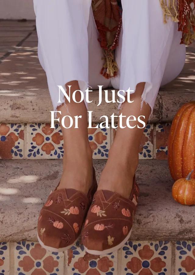 Not Just for Lattes. Shop Now. Model wearing Alpargata Classic in Brown Corduroy with Embroidered Pumpkins.