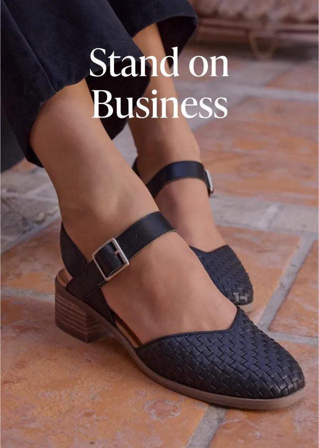 Stand on Business. Shop Now. Model wearing the black leather basketweave Jaclyn Heel.